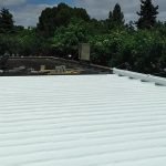 Dura-Foam roof in progress. Foam over metal.
