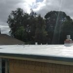 Residential dura foam roof with cloudy sky