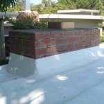 Spray foam roof with red brick chimney