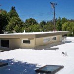 Sprayed foam roofing. HVAC visible under foam.