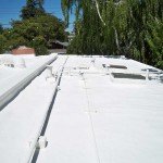 Sprayed foam roofing. HVAC visible under foam.
