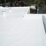 Dura-Foam sprayed foam roof with company vehicle in background