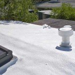 Spray foam roofing including vents and skylights