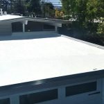 Spray Polyurethane Foam roof on grey Eichler house.