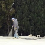 Dura-Foam employees spraying foam roof